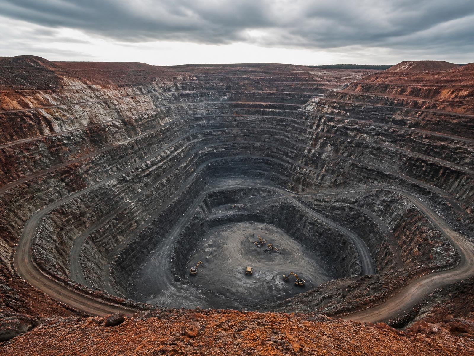 Open-pit mining operation at sunrise